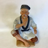 Asian Gentleman Porcelain Figurine