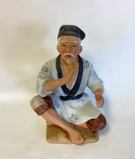 Asian Gentleman Porcelain Figurine